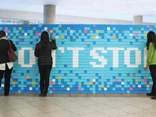 Sticky note mural, Community bookshelf