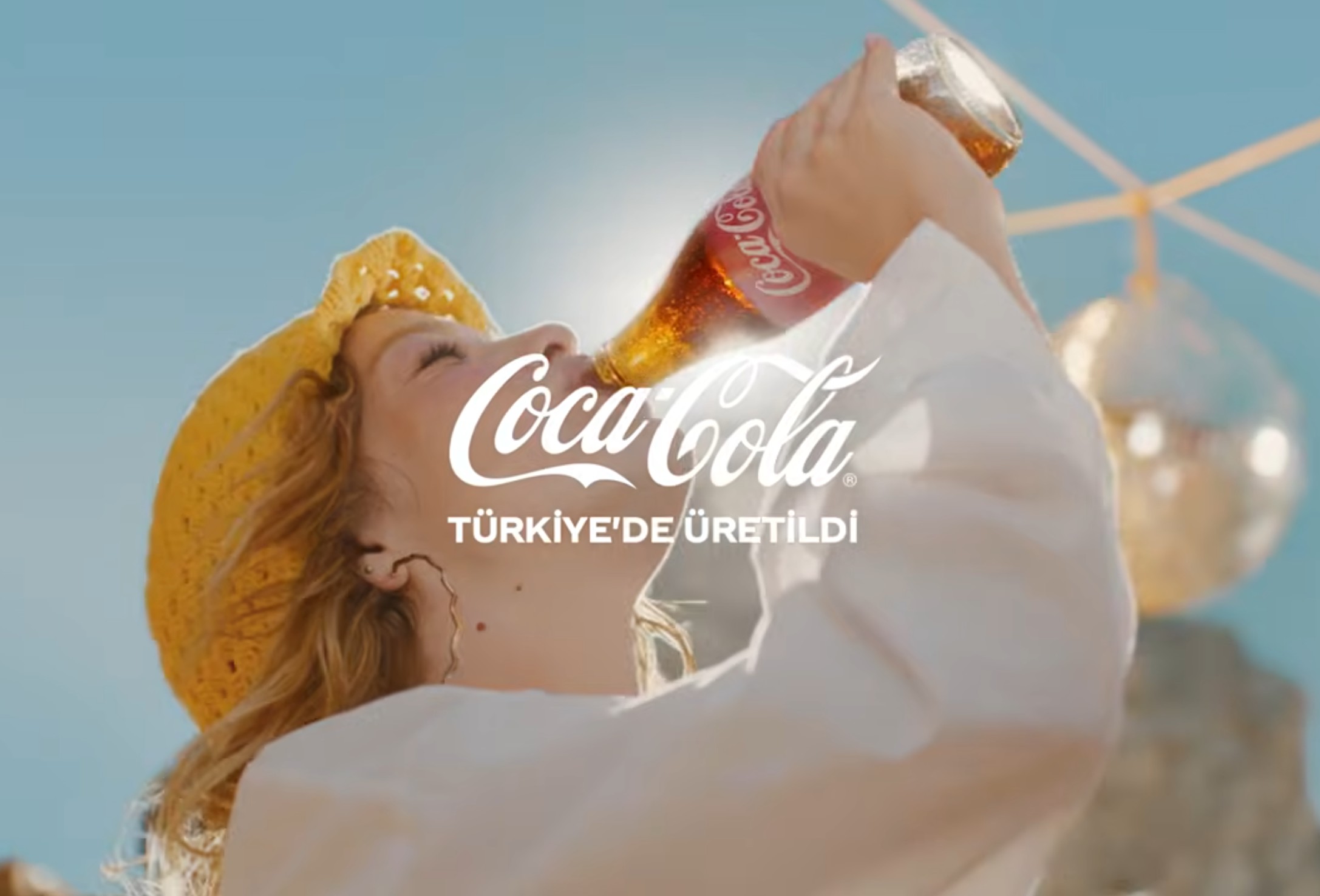 Open a Coca-Cola, experience the amazing taste. Image